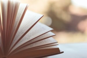Angled picture of semi-open book and unfocused background