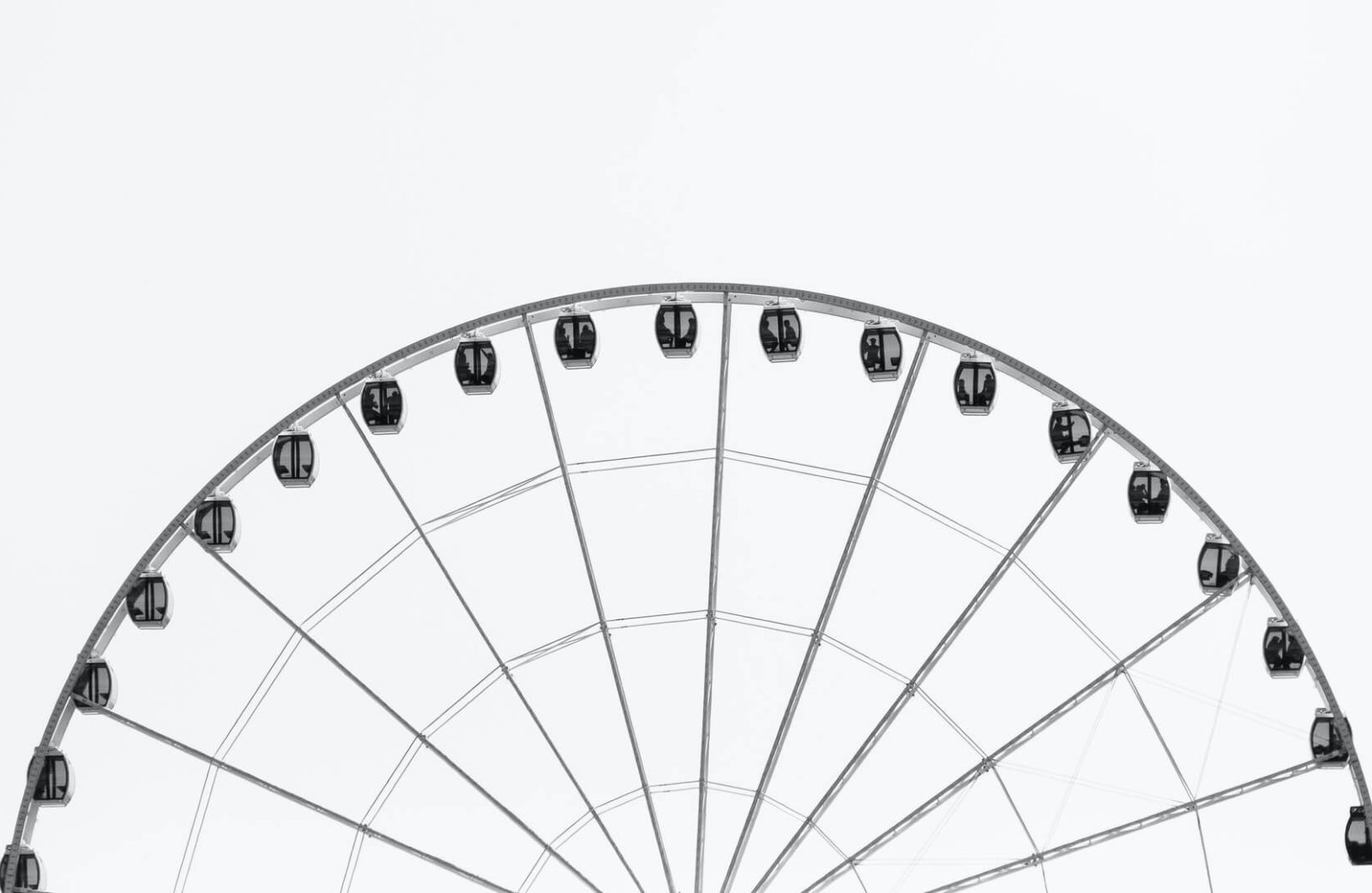 Greyscale of top part of a Ferris Wheel