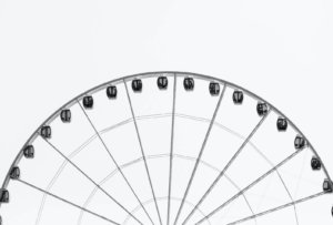 Greyscale of top part of a Ferris Wheel